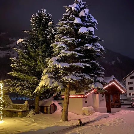 Alpehytte In Grund Amid Mountains